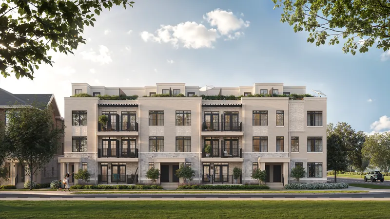 Rendering of the South Banks Elevation C townhome block in light brick with rooftop terraces